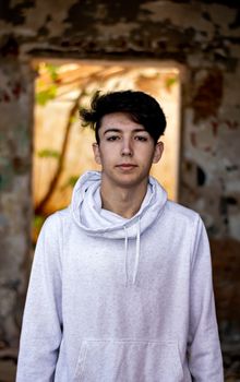 Young boy posing in abandoned house