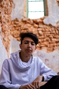 Young boy posing in abandoned house