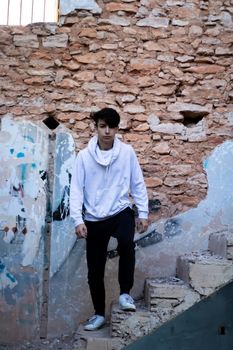 Young boy posing in abandoned house