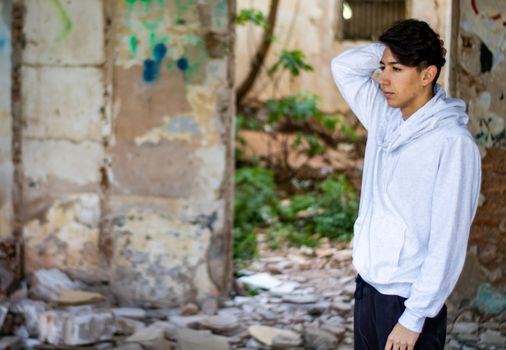 Young boy posing in abandoned house