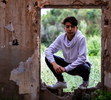 Young boy posing in abandoned house