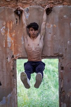 Young boy posing in abandoned house