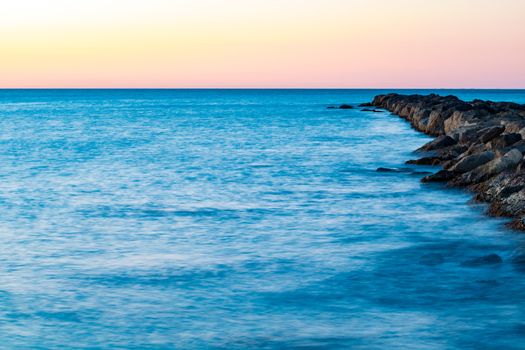 Breakwater at Burriana beach in long exposure