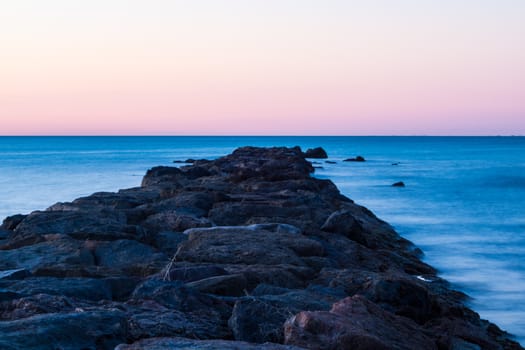 Breakwater at Burriana beach in long exposure