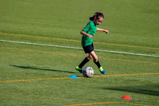 Little girl in a soccer training in Burriana