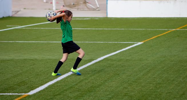 Little girl in a soccer training in Burriana