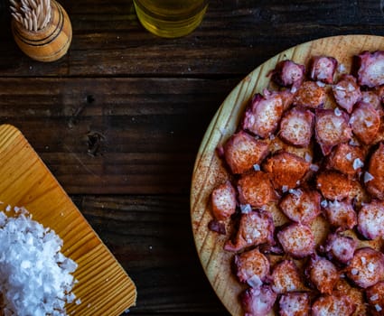 View of Galician octopus dish on old wooden background