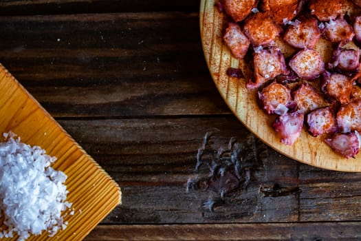 View of Galician octopus dish on old wooden background