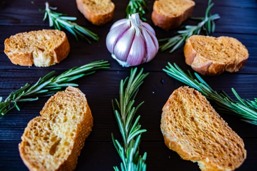 Ingredients for garlic soup in composition on wooden background