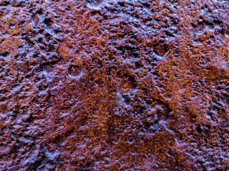 Natural rock background in reddish tones and rough texture