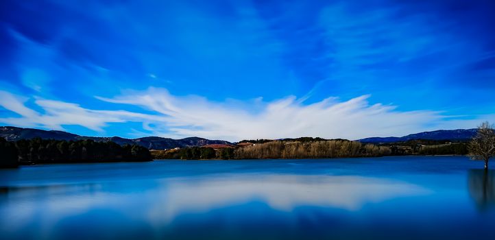 View of the Regajo reservoir with the mountains in the background