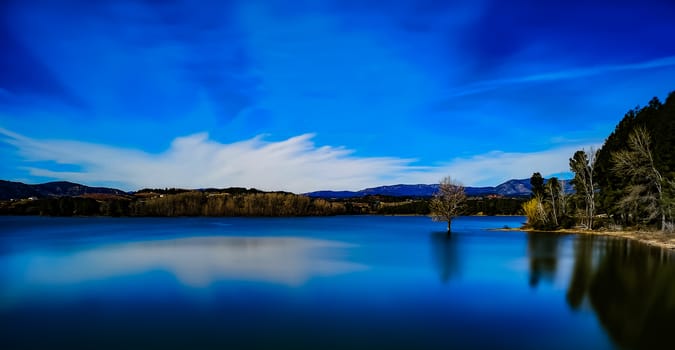 View of the Regajo reservoir with the mountains in the background
