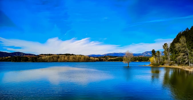 View of the Regajo reservoir with the mountains in the background