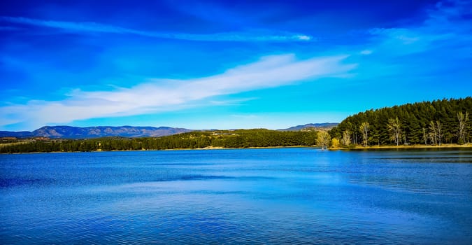 View of the Regajo reservoir with the mountains in the background