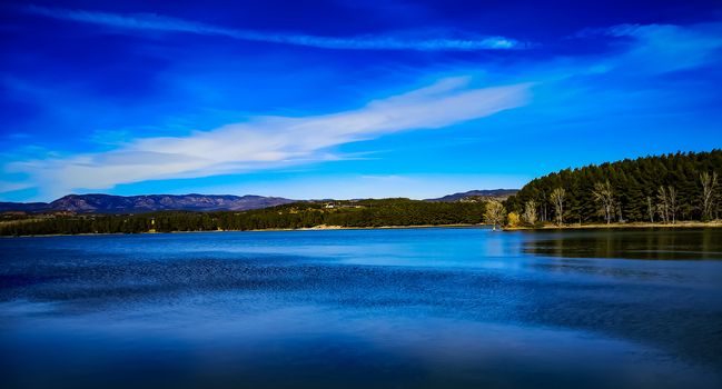 View of the Regajo reservoir with the mountains in the background