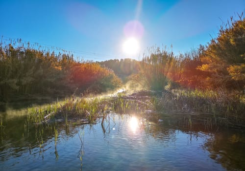 River with water evaporating on a very cold morning in the mountain