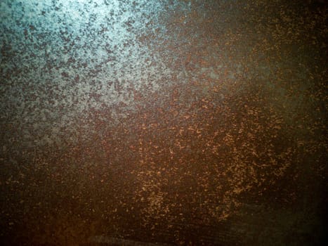 Rusty metal background with rough texture in brown tones