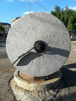 Ancient stone mill to make olive oil exposed in the town square