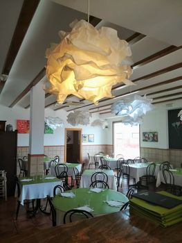 Interior decoration of a restaurant with peculiar withe lamps