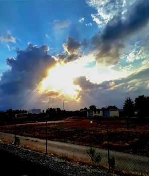 Sunset with threatening storm clouds over mountains