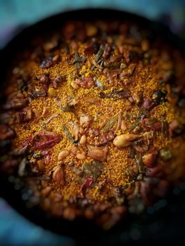 Typical Spanish food of rice, meat and vegetables in special flat casserole for this meal