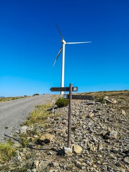 Wind generators on the mountain with blue sky in the background
