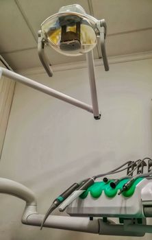 View of lamp and instruments of a dentist from the armchair