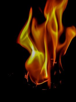 Fire in orange and yellow tones with peculiar shapes with black background