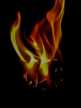 Fire in orange and yellow tones with peculiar shapes with black background