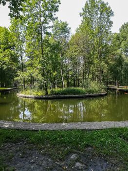 View of very green trees and grass in a large park of Puerto de Sagunto