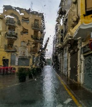 View of the square of Agua Limpia distorted by the effect of water drops