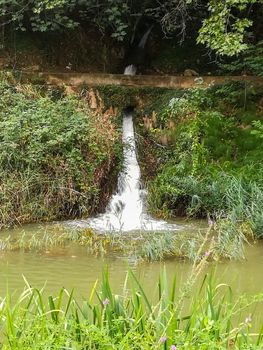 View of Palancia river a lot of vegetation as it passes through Segorbe