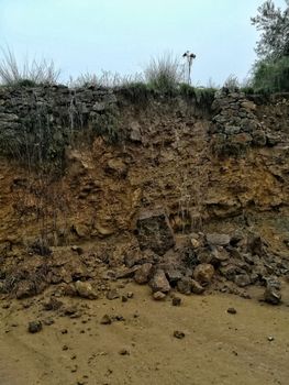 Detachment of rocks in a wall after heavy raiin