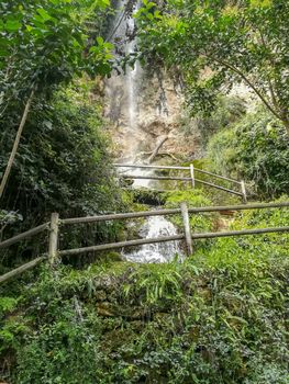 View of a waterfall in Navajas with wooden walkways