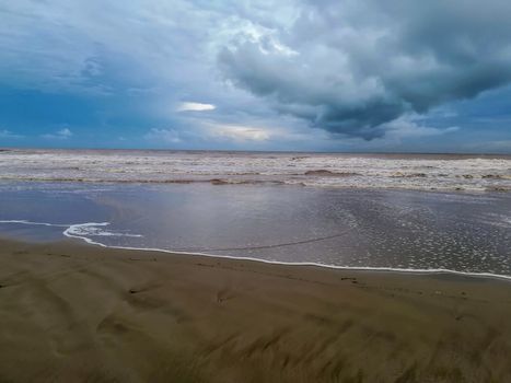 Beach of fine brown sand bathed by the waters of the Mediterranean Sea