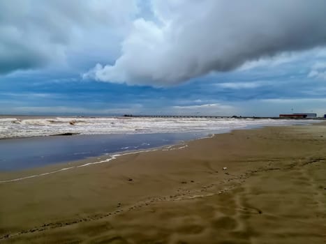 Beach of fine brown sand bathed by the waters of the Mediterranean Sea