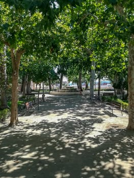 View of a park in Segorbe with a fountain in the background