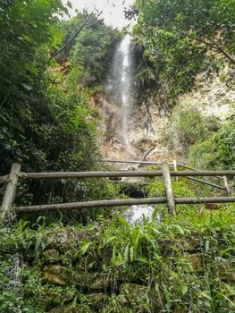 View of a waterfall in Navajas with wooden walkways