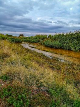 River of the natural setting of Clot with sediment laden water after heavy rains