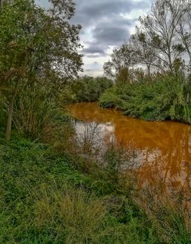River of the natural setting of Clot with sediment laden water after heavy rains