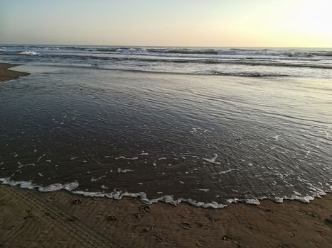 Beach of fine brown sand bathed by the waters of the Mediterranean Sea