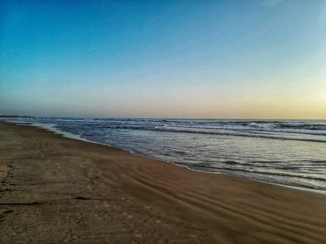 Beach of fine brown sand bathed by the waters of the Mediterranean Sea