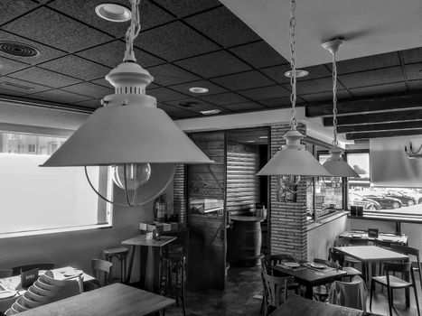 View of the interior of a black and white cafeteria in the Puerto de Sagunto