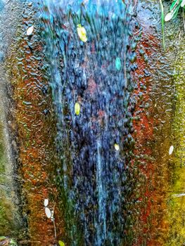 Colorful rust background with crystal clear water flowing