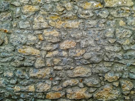 Facade of natural stone and gray cement