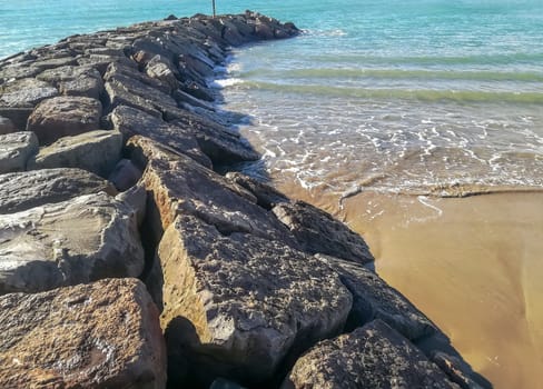 Beach of fine brown sand bathed by the waters of the Mediterranean Sea