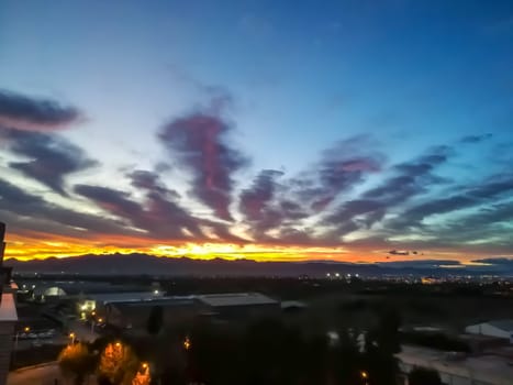 Sunset with threatening storm clouds over mountains