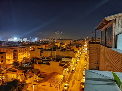 Night view of the town of Burriana with the lights of the San Fernando Stadium in the background