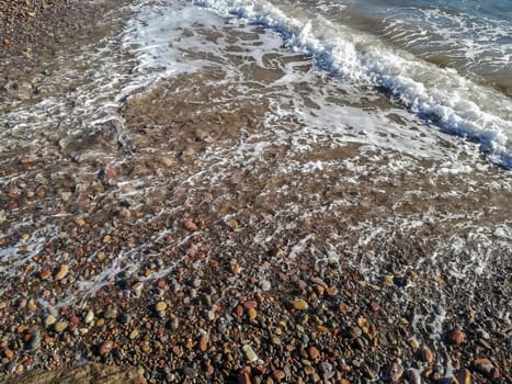 Small stone beach bathed by the waters of the Mediterranean Sea