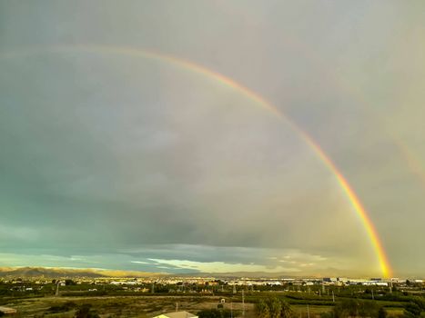 View of two rainbow media on a cloudy day